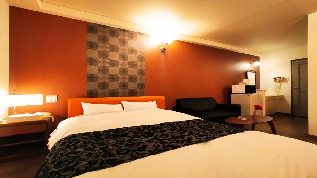 Postel nebo postele na pokoji v ubytování Hotel Wave大人専用