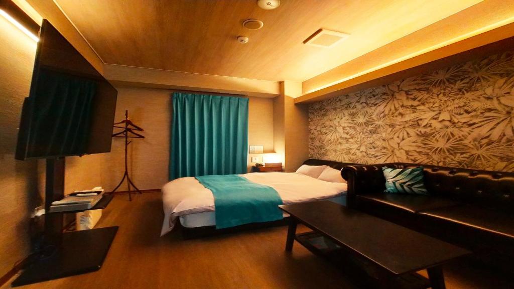 Postel nebo postele na pokoji v ubytování Hotel Wave大人専用