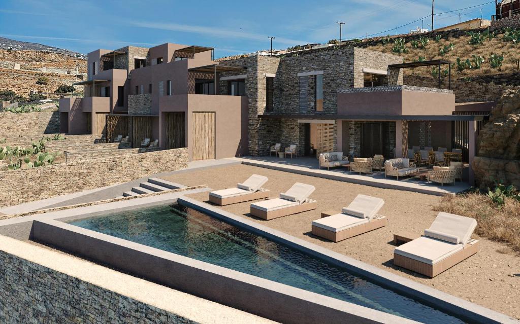 uma villa com uma piscina e uma casa em Sun Aeriko em Tinos Town