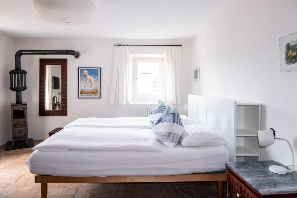Postel nebo postele na pokoji v ubytování Guesthouse Arosio B&B