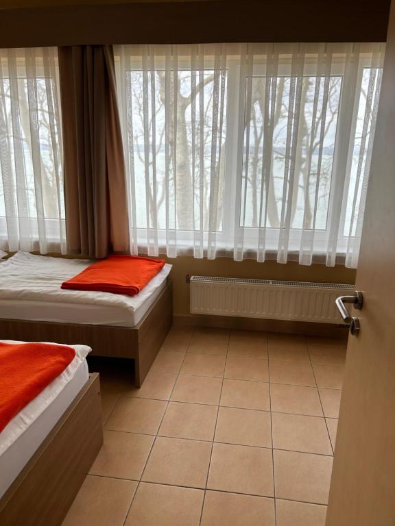 Postel nebo postele na pokoji v ubytování BF Hotel
