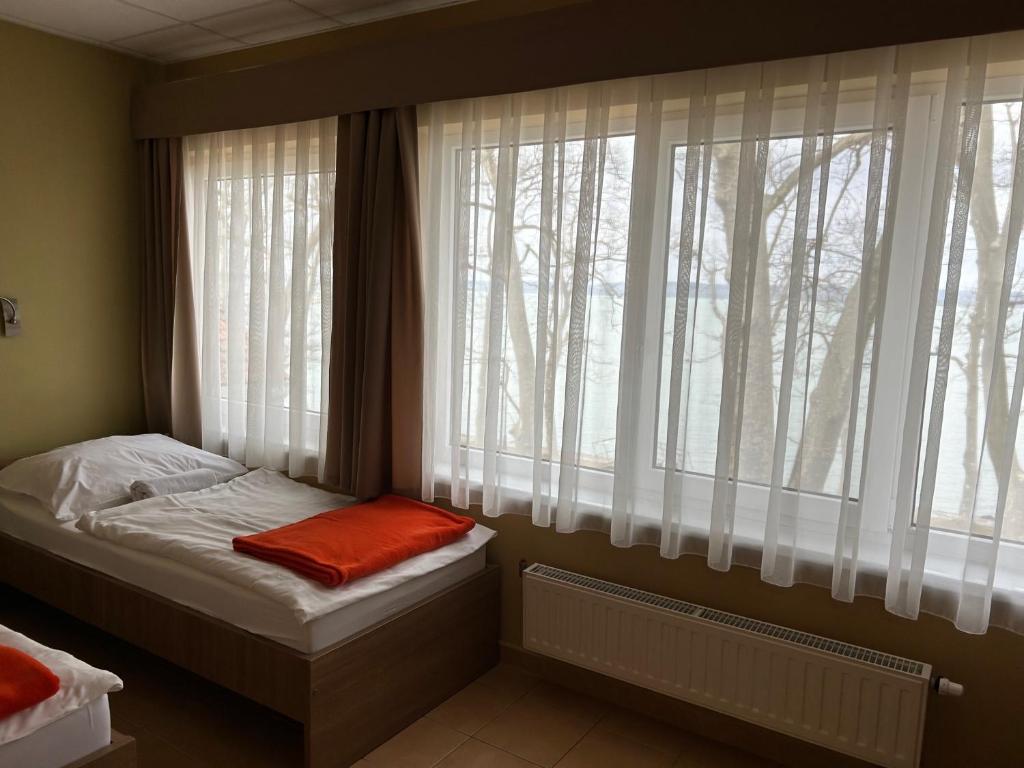 Postel nebo postele na pokoji v ubytování BF Hotel