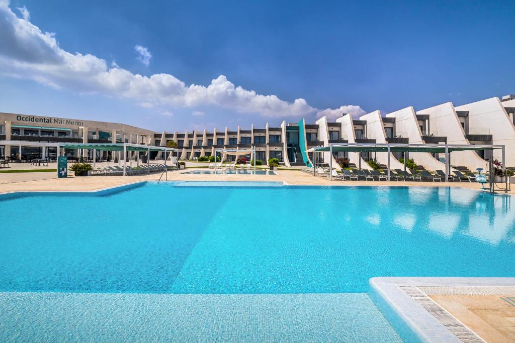 a large swimming pool in front of a building at Occidental Mar Menor in Cartagena