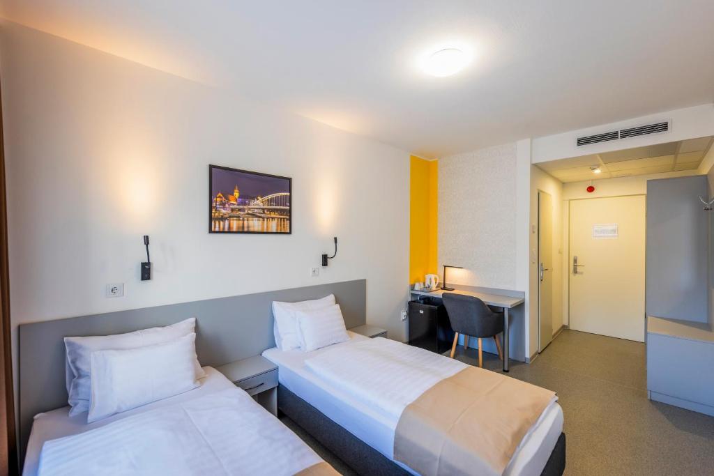 Postel nebo postele na pokoji v ubytování Arrabona Rooms