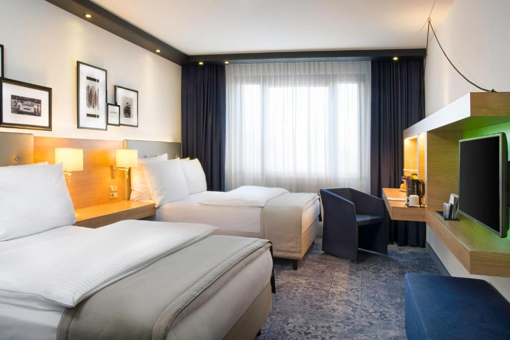 Postel nebo postele na pokoji v ubytování Holiday Inn Stuttgart by IHG