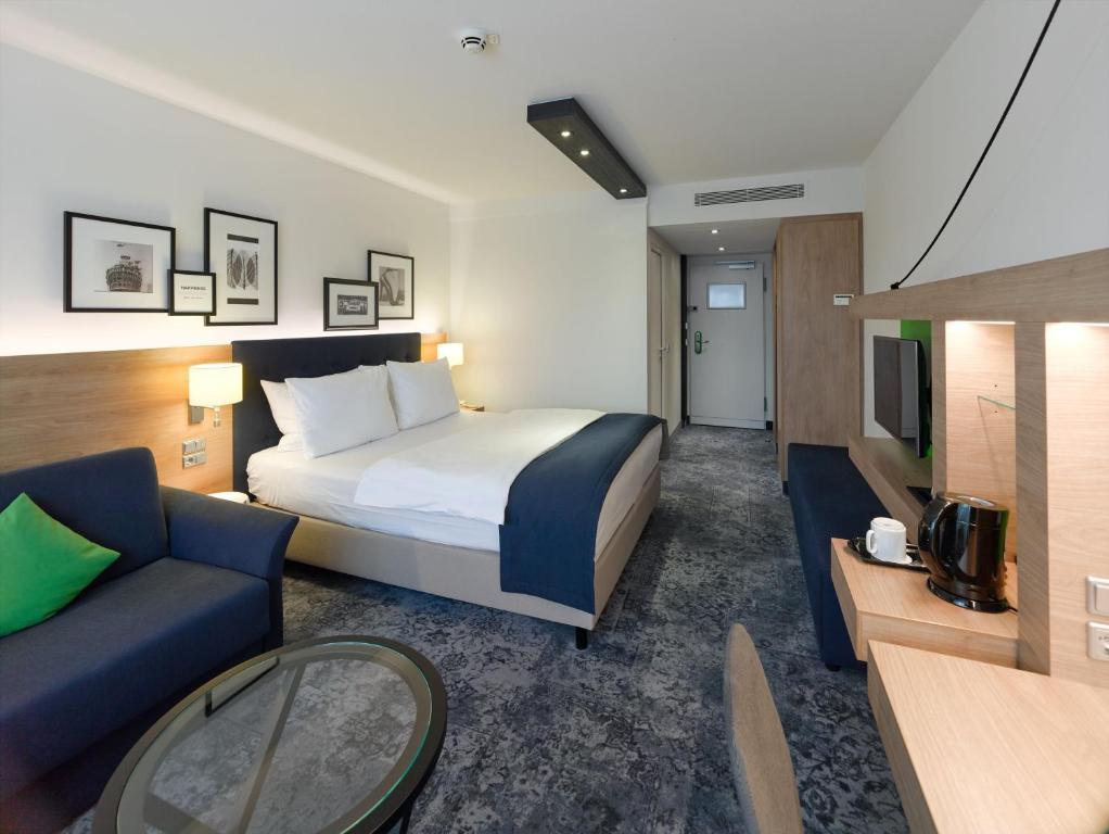 Postel nebo postele na pokoji v ubytování Holiday Inn Stuttgart by IHG
