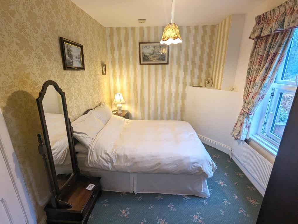 Postel nebo postele na pokoji v ubytování Gleneven Guest House