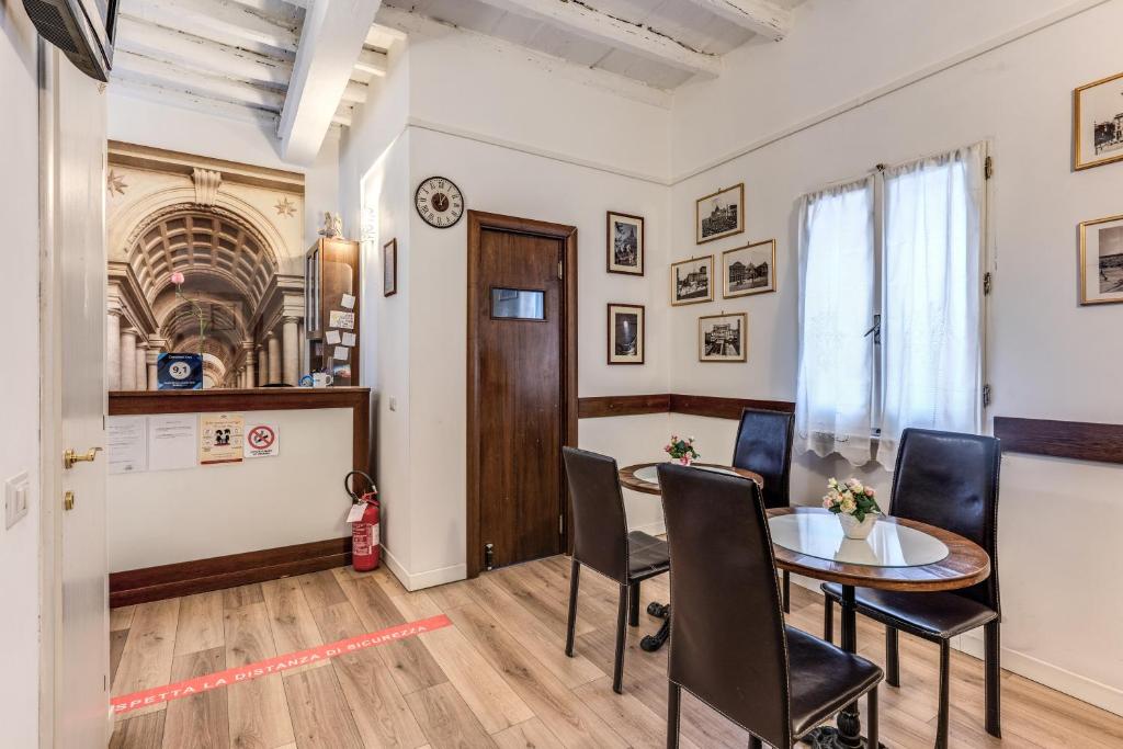 a meeting room with a table and chairs in a building at Magenta Deluxe Cancello in Rome