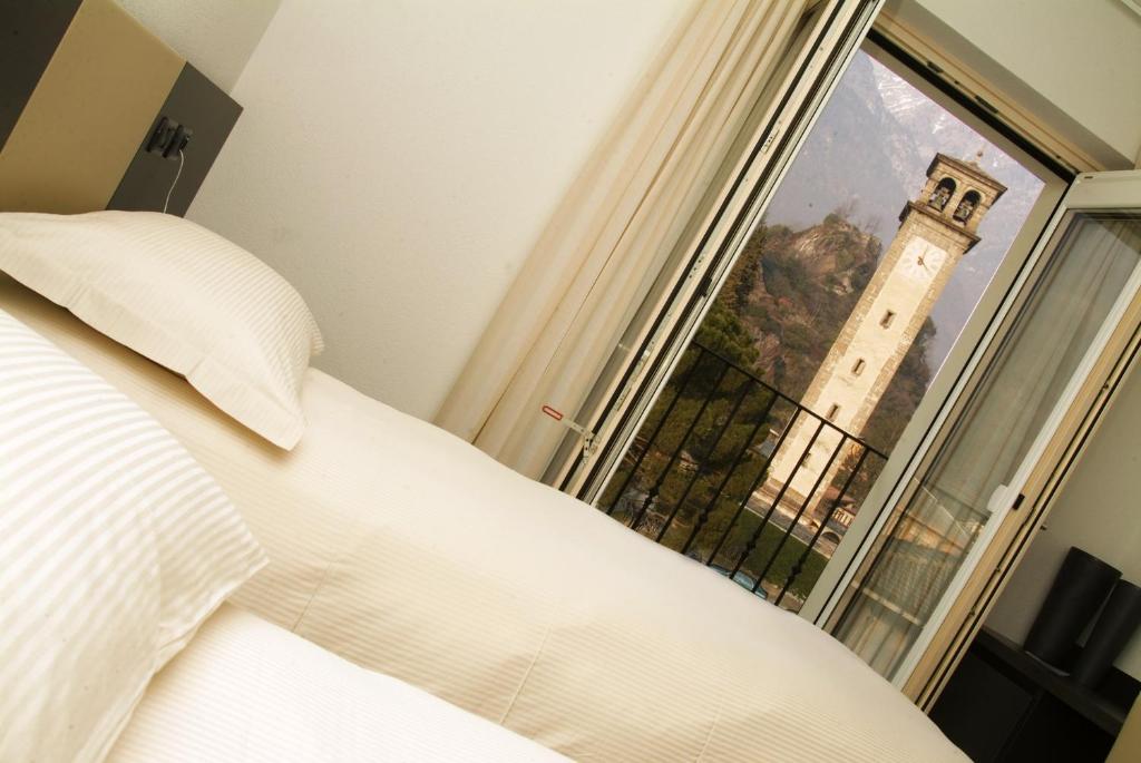 Postel nebo postele na pokoji v ubytování Hotel San Lorenzo Chiavenna