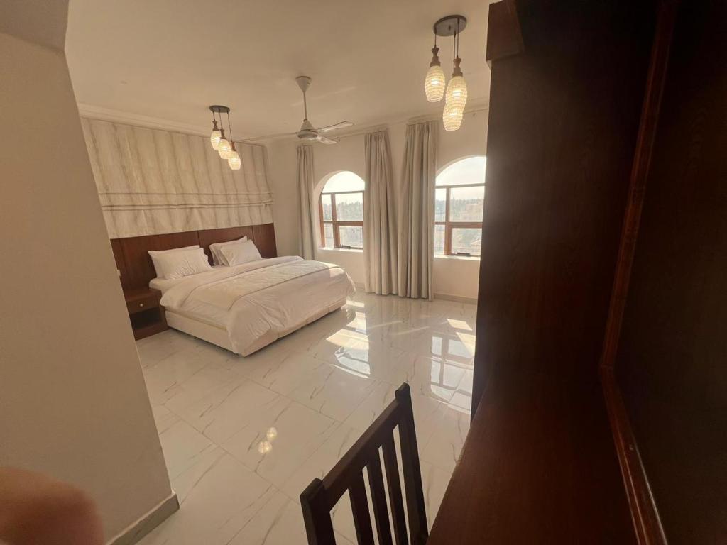 Postel nebo postele na pokoji v ubytování RED-22- ALSALAM suites