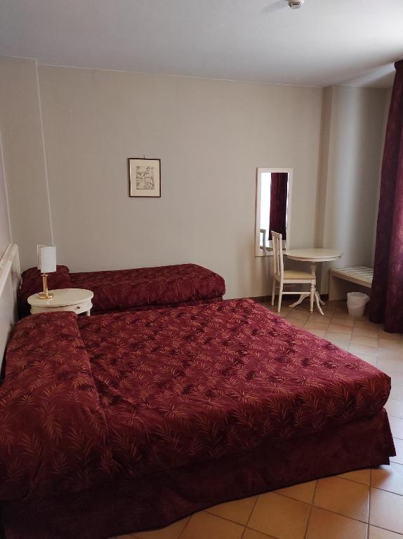 Postel nebo postele na pokoji v ubytování Hotel Le Mura