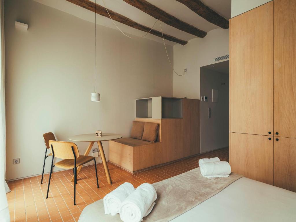 Postel nebo postele na pokoji v ubytování Boutique Apartments 23 Barcelona