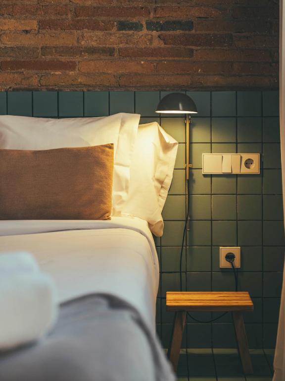 Postel nebo postele na pokoji v ubytování Boutique Apartments 23 Barcelona