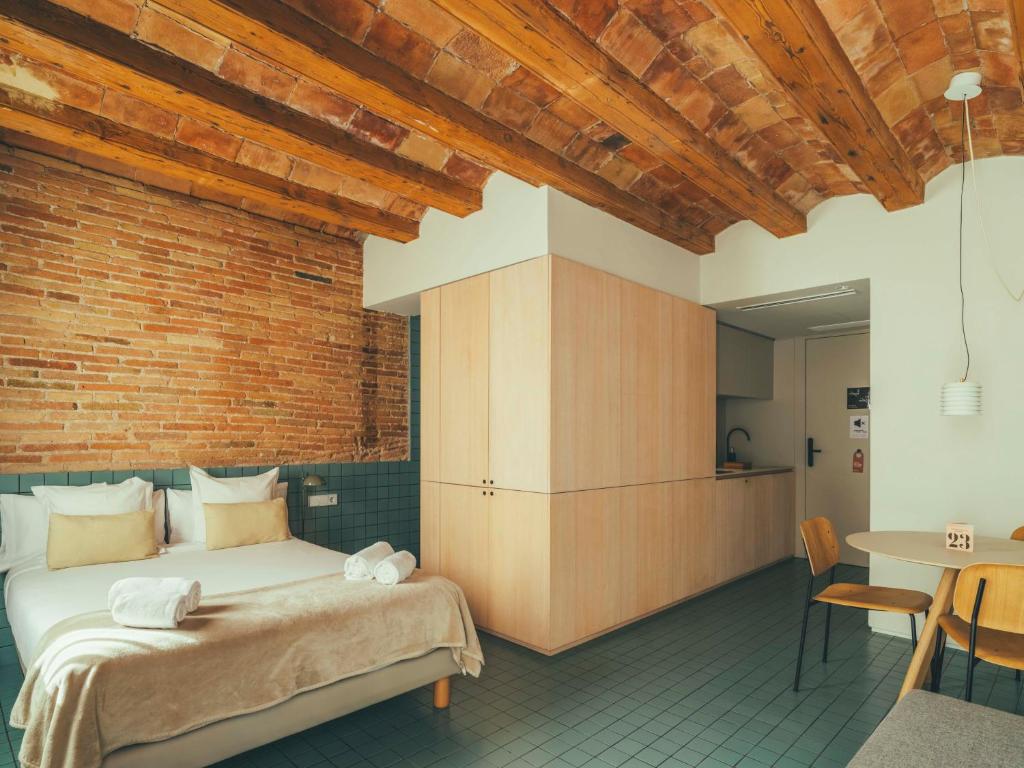 Postel nebo postele na pokoji v ubytování Boutique Apartments 23 Barcelona