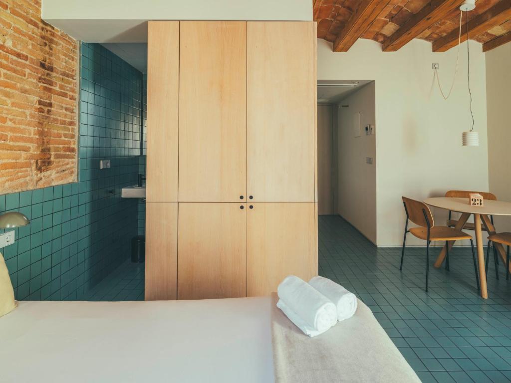 Postel nebo postele na pokoji v ubytování Boutique Apartments 23 Barcelona