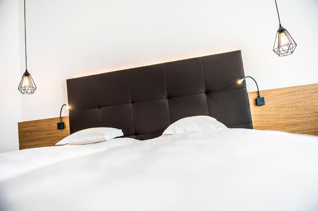 Postel nebo postele na pokoji v ubytování Hotel Törggelehof