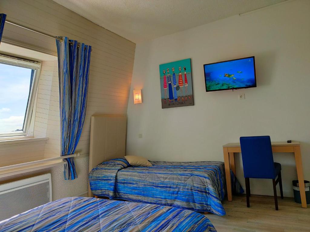 Postel nebo postele na pokoji v ubytování Hôtel le Littoral