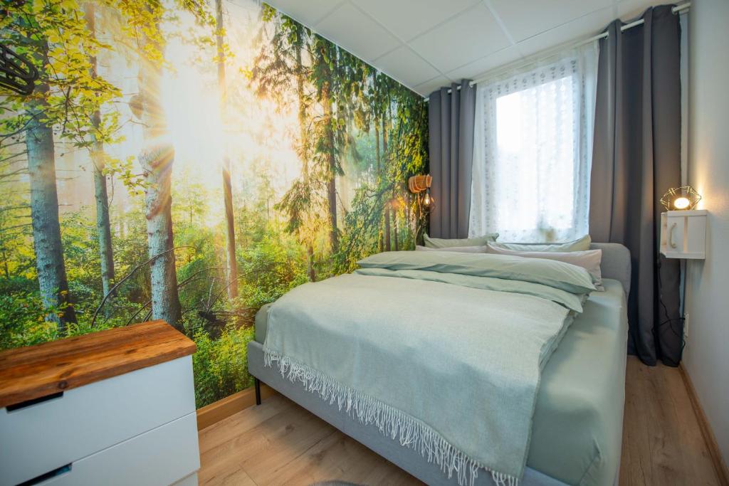 a bedroom with a bed and a large window at Ferienwohnung im Zentrum von Eisenach in Eisenach