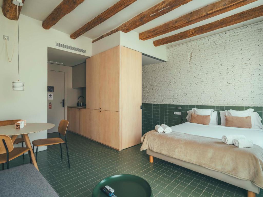 Postel nebo postele na pokoji v ubytování Boutique Apartments 23 Barcelona