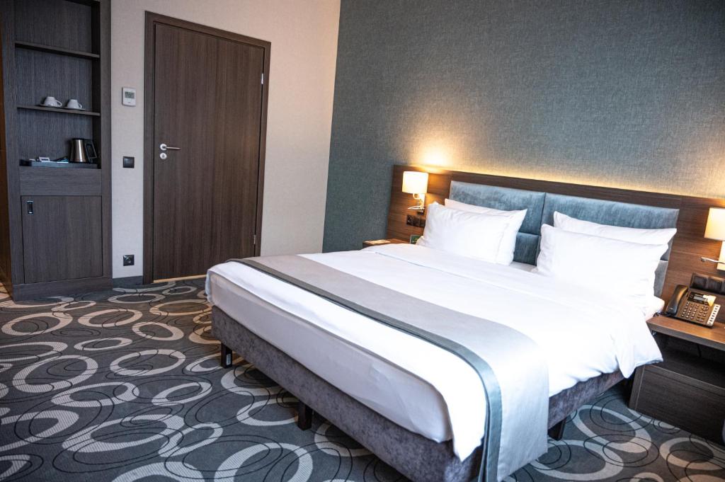 Posteľ alebo postele v izbe v ubytovaní Holiday Inn Dąbrowa Górnicza-Katowice by IHG