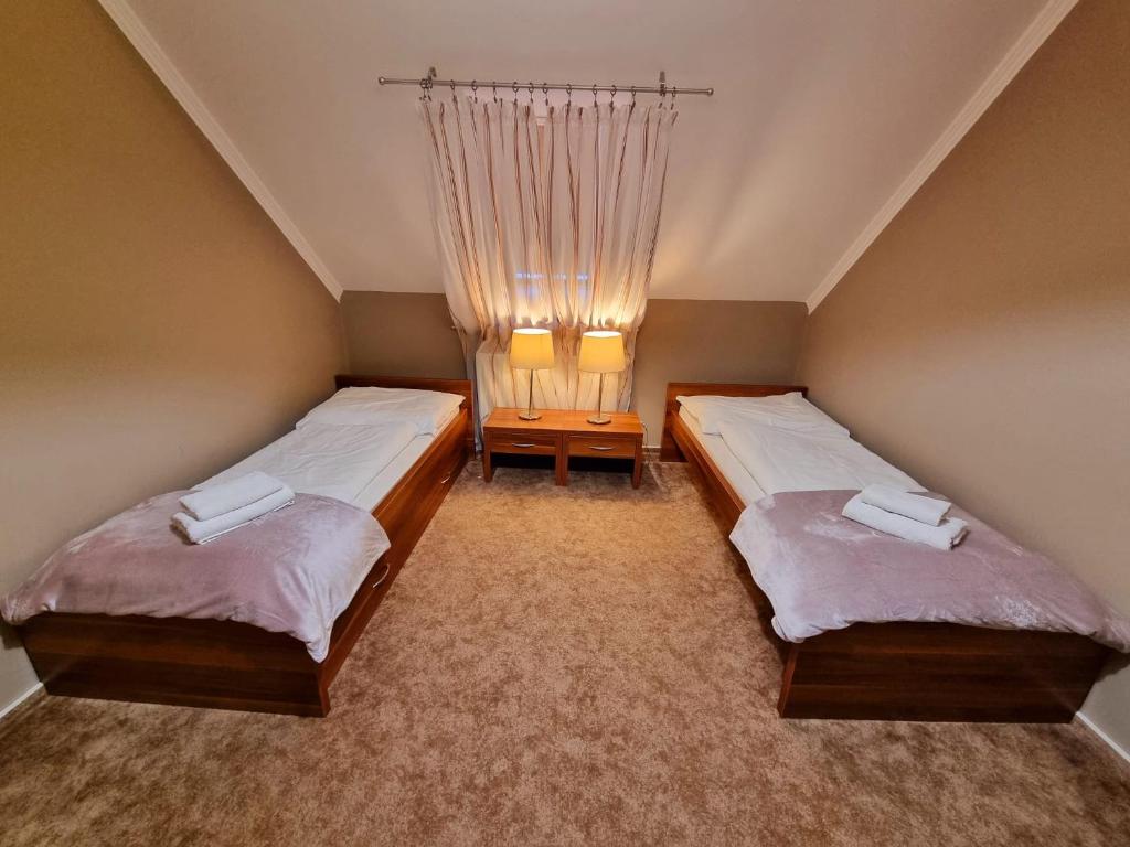 Postel nebo postele na pokoji v ubytování B&B Penzión Magura
