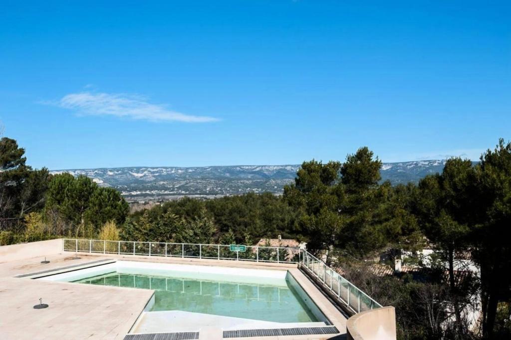 a swimming pool on the roof of a house at Les Coteaux de Pont Royal en Provence - maeva Home - Appartement 3 pièces 6 214 in Mallemort
