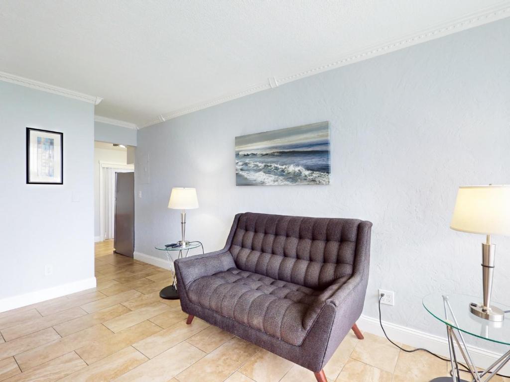 a living room with a couch and a table at The Grand Resort and Spa & Worthington All Male in Fort Lauderdale