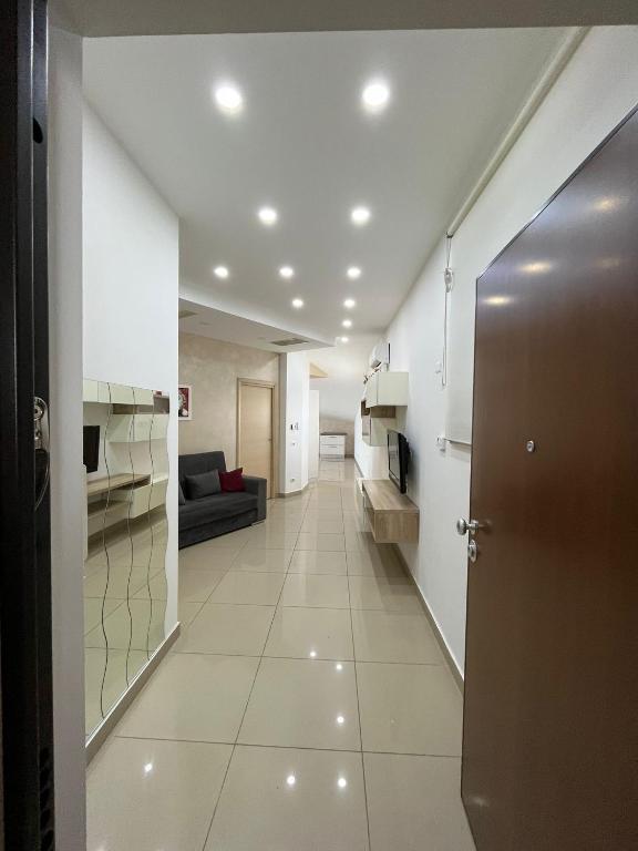 a hallway with a door leading to a living room at Casa vacanza Helios in Leonforte