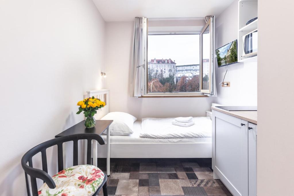 Postel nebo postele na pokoji v ubytování Apartmány U zámku