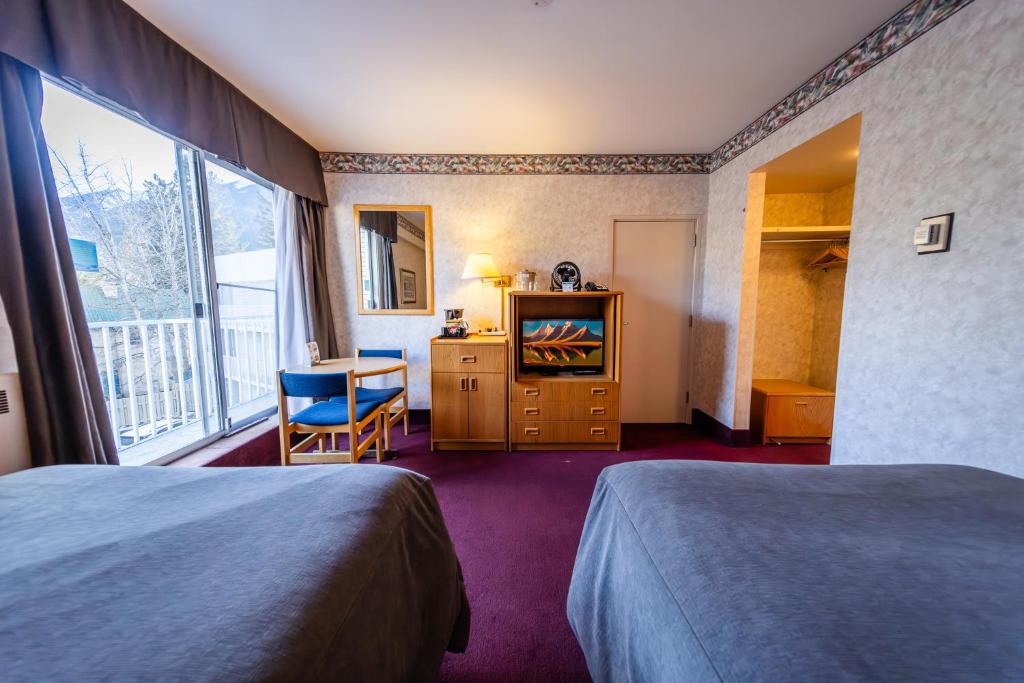 Postel nebo postele na pokoji v ubytování Bow View Lodge