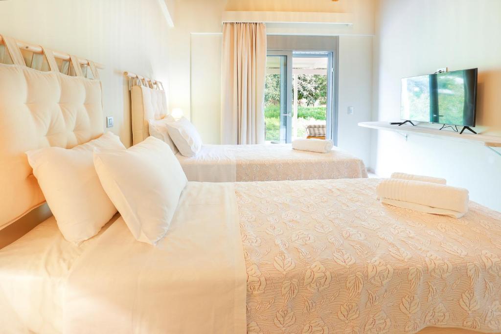 Postel nebo postele na pokoji v ubytování Villa Theoni