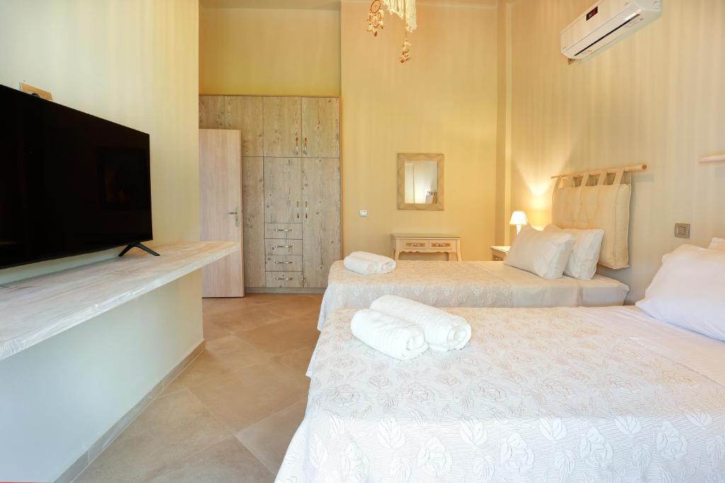 Postel nebo postele na pokoji v ubytování Villa Theoni