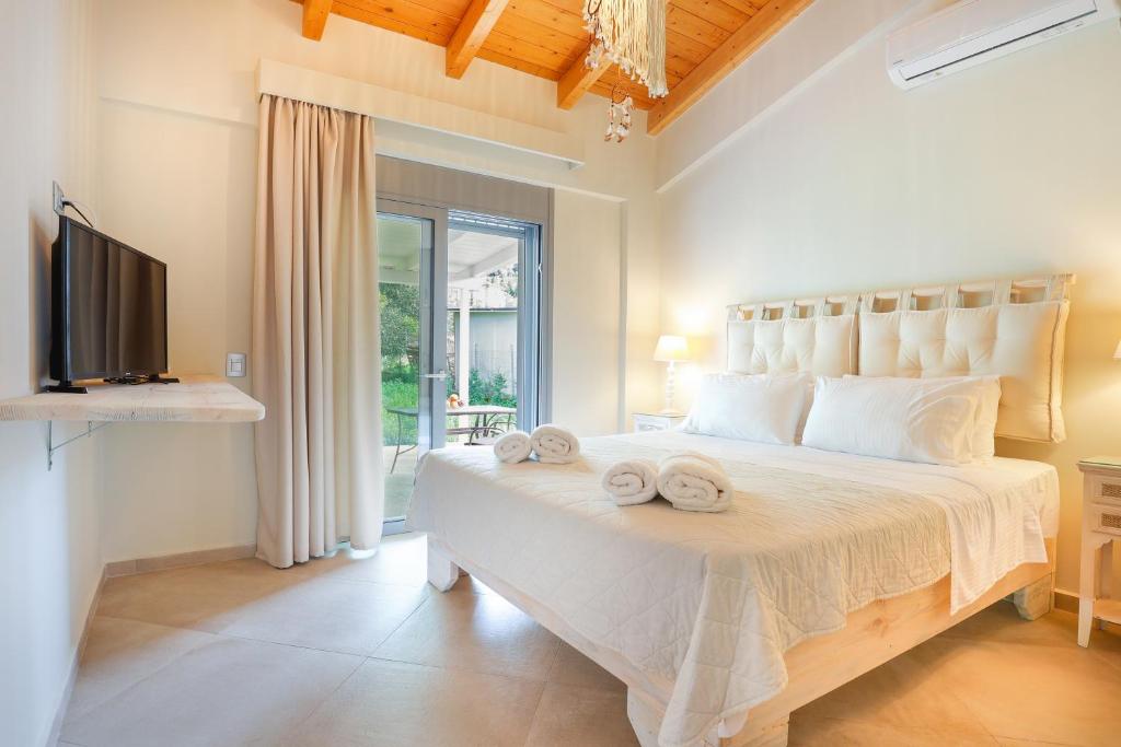 Postel nebo postele na pokoji v ubytování Villa Theoni