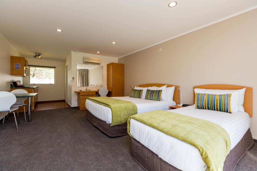 Postel nebo postele na pokoji v ubytování Aspen Court Motel Taihape