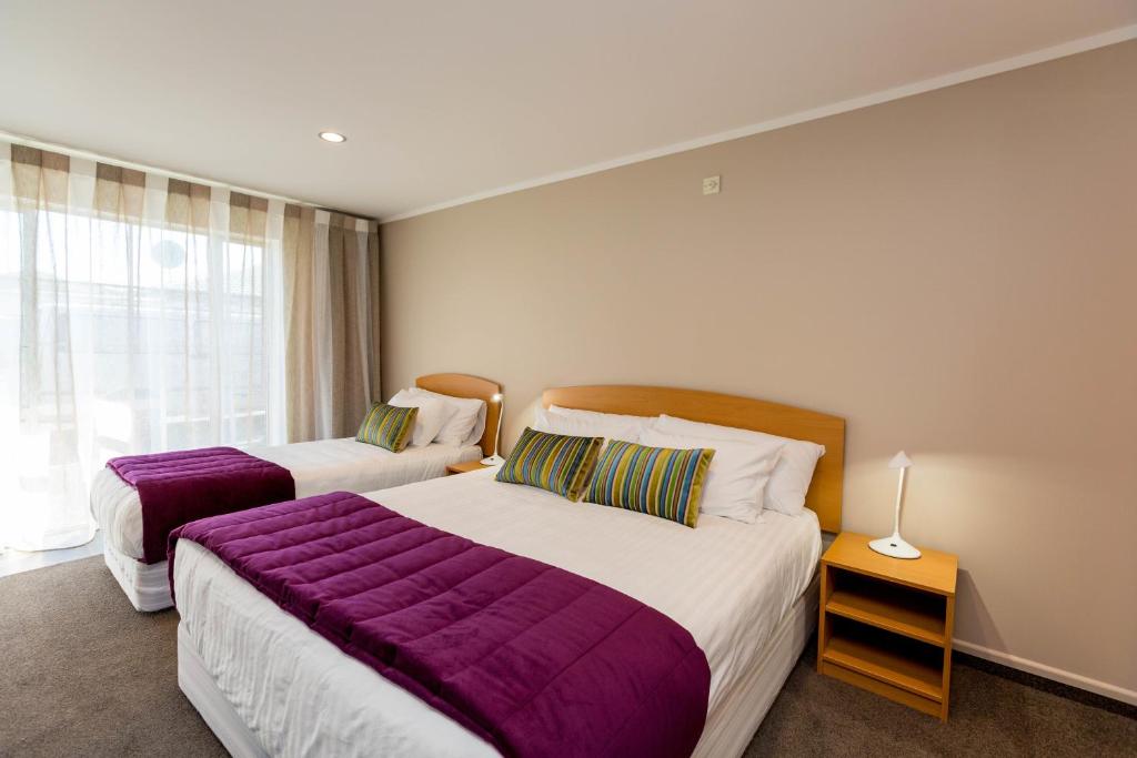 Postel nebo postele na pokoji v ubytování Aspen Court Motel Taihape