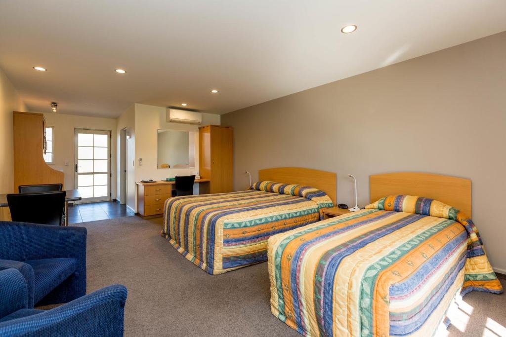 Postel nebo postele na pokoji v ubytování Aspen Court Motel Taihape