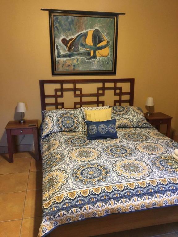 Postel nebo postele na pokoji v ubytování Mango Tree Villas