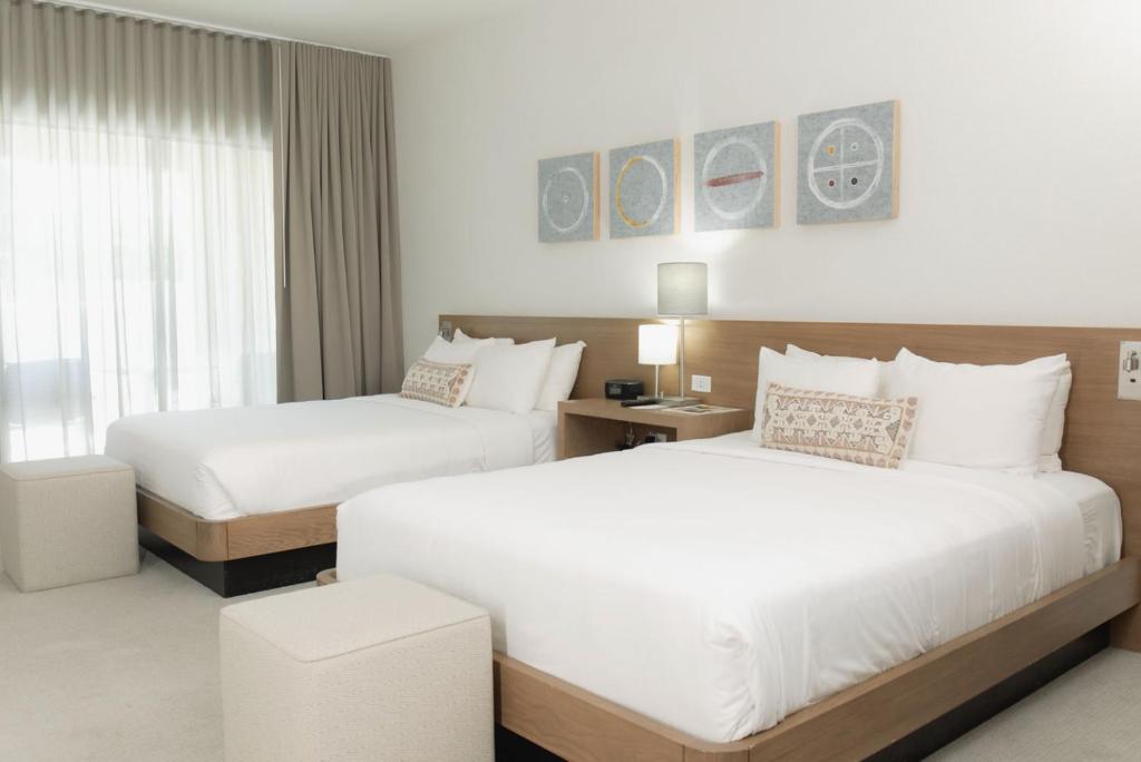 Postel nebo postele na pokoji v ubytování CIVANA Wellness Resort & Spa