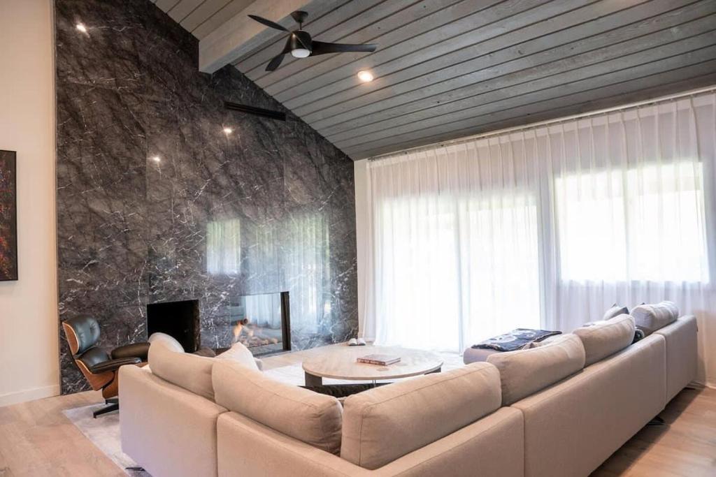 a living room with a large couch and a table at Elkhorn Sun Valley & Dollar Mountain Adventures in Sun Valley
