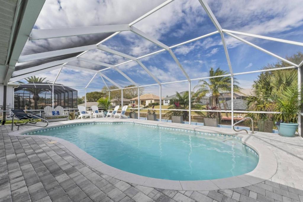 a large swimming pool with a clear cover over it at Collinson Sea Stone | Palm Coast in Palm Coast