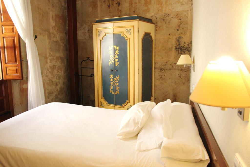 Postel nebo postele na pokoji v ubytování Hotel Microtel Placentinos