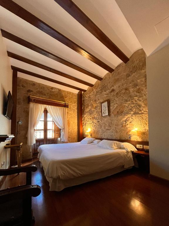 Postel nebo postele na pokoji v ubytování Hotel Microtel Placentinos