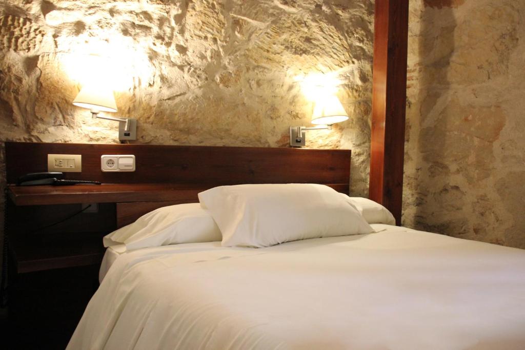 Postel nebo postele na pokoji v ubytování Hotel Microtel Placentinos