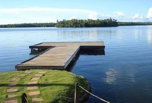 a dock in the middle of a large body of water at Camotes Resthouse in Camotes Islands