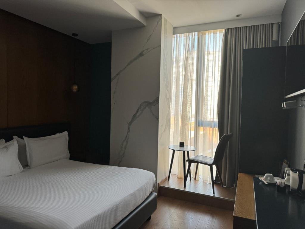 Postel nebo postele na pokoji v ubytování Black Diamond Hotel