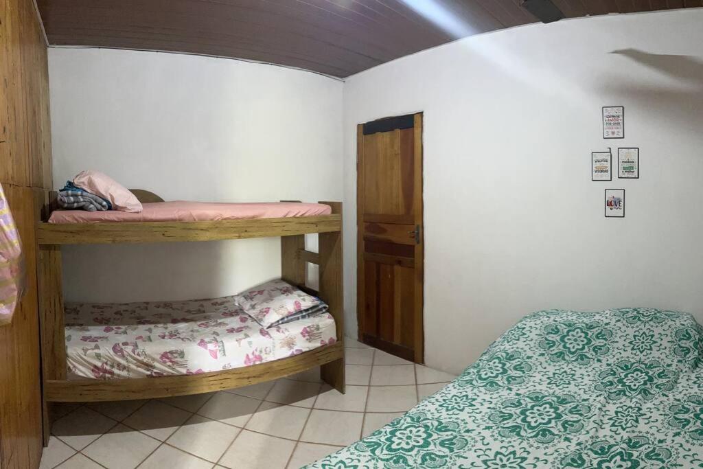 a small room with two bunk beds in it at Kitinet com 01 quarto in Vila Velha