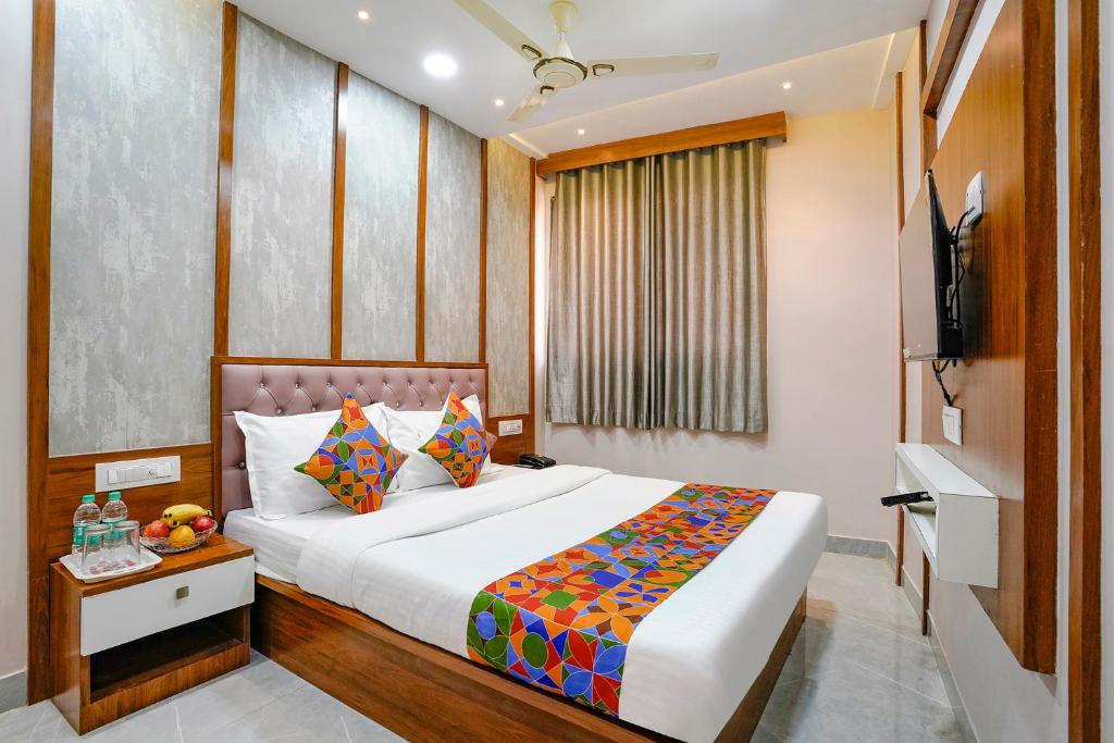 a hotel room with a bed and a television at Hotel Affari in Mumbai
