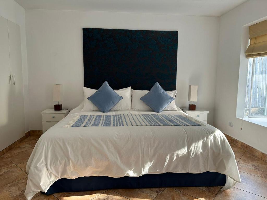 Postel nebo postele na pokoji v ubytování Hotel Los Palomos