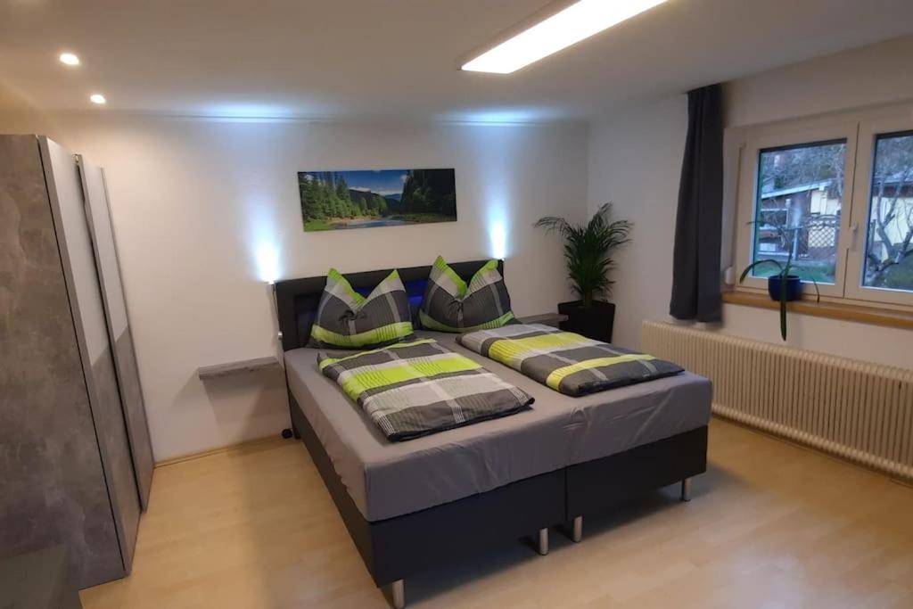 Postel nebo postele na pokoji v ubytování Ferienwohnung in Weyregg am Attersee