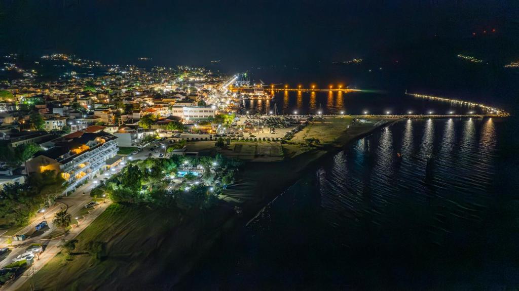 an aerial view of a city at night at Hotel Summery in Lixouri